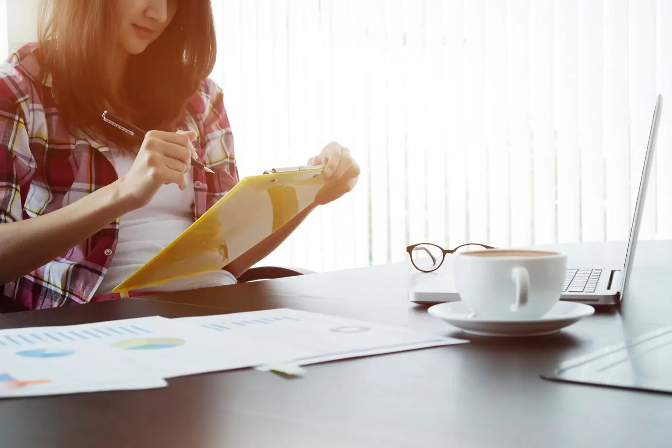 A young businesswoman working on a new startup project in a modern coworking space.